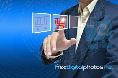 Man Touching Shopping Cart Stock Photo