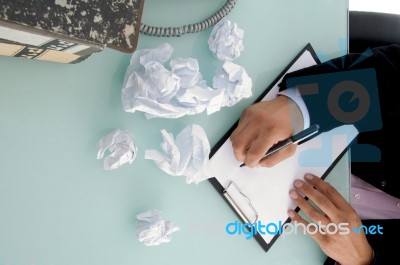 Man Trying To Write Something Stock Photo