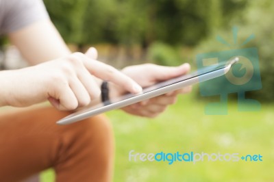 Man Use Tablet Reading News And Communicate On Social Networks Stock Photo