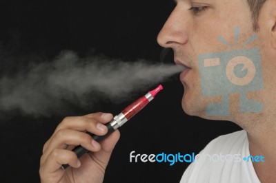 Man Using Electronic Cigarette Stock Photo