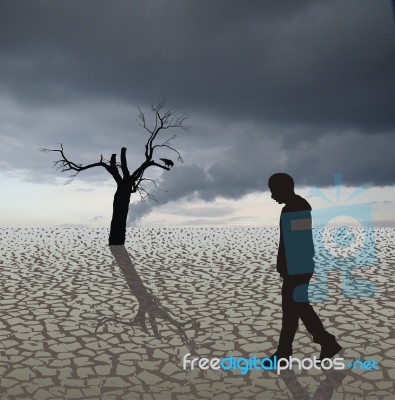 Man Walking Alone In Arid Land Stock Image
