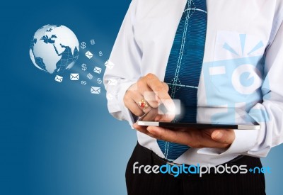 Man With A Global Technology Background With The Planet Earth Stock Photo