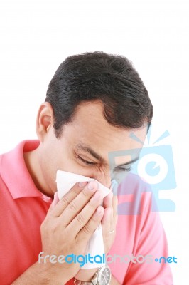 Man With Cold Blowing Nose Stock Photo