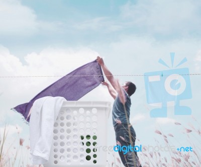 Man With Laundry Background Concept Stock Photo