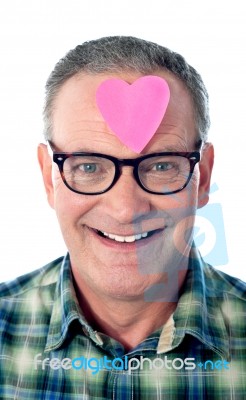 Man With Paper Heart in Forehead Stock Photo