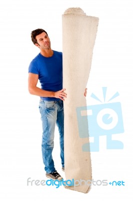Man With Roll Of Carpet Stock Photo