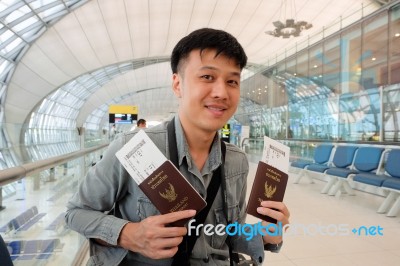 Man With Thailand Passports In Hands At Airport Stock Photo