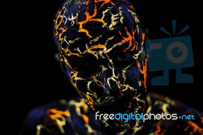 Man's  Face Painted In Neon Uv Lava Stock Photo
