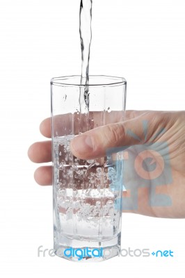 Man's Hand Holding Glass Of Natural Water, Isolated On White Stock Photo