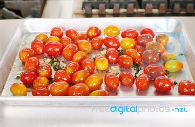 Many Colorful Tomato Red And Yellow On A Tray Ready To Be Served… Stock Photo