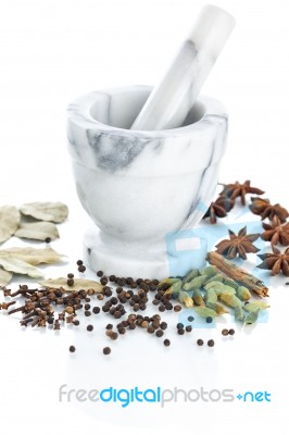 Marble Mortar And Pestle With Assorted Spices On White Backgroun… Stock Photo