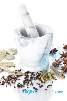 Marble Mortar And Pestle With Assorted Spices On White Backgroun… Stock Photo