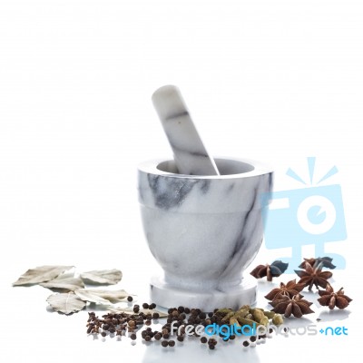 Marble Mortar And Pestle With Assorted Spices On White Backgroun… Stock Photo