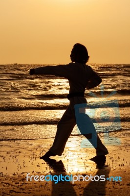 Martial Art Training In Silhouette Stock Photo