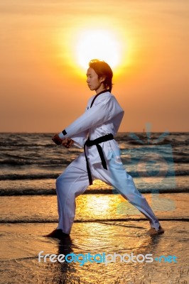 Martial Art Training On Beach Stock Photo