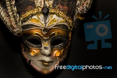 Masks And Feathers Of Venice Carnival On Black Background Stock Photo