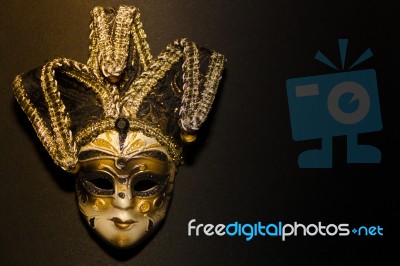 Masks And Feathers Of Venice Carnival On Black Background Stock Photo