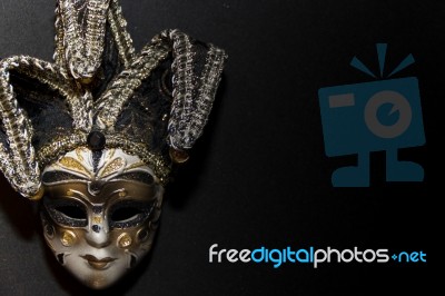 Masks And Feathers Of Venice Carnival On Black Background Stock Photo