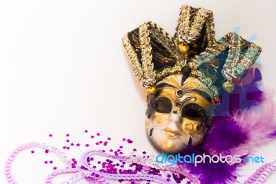 Masks And Feathers Of Venice Carnival On White Background Stock Photo