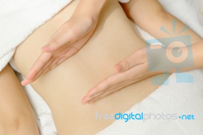 Masseur Applying Massage Techniques To Relax Back Muscles Stock Photo