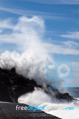 Massive Wave Hitting The Rocky Shore In Tenerife Stock Photo