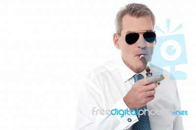 Mature Businessman Smoking A Cigar Stock Photo Mature Businessman Smoking A Cigar Stock Photo