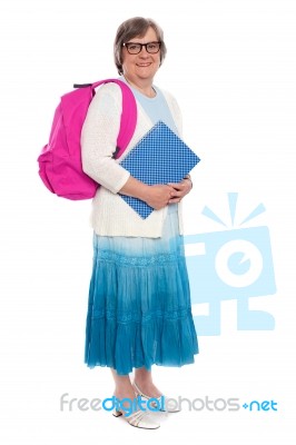 mature student with bag and note Stock Photo