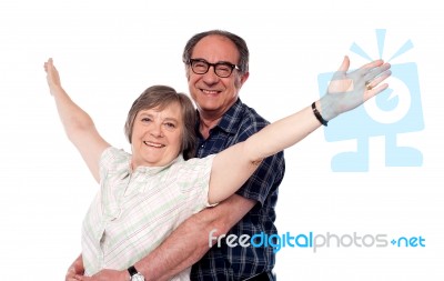 Mature Woman With Arms Raised Stock Photo