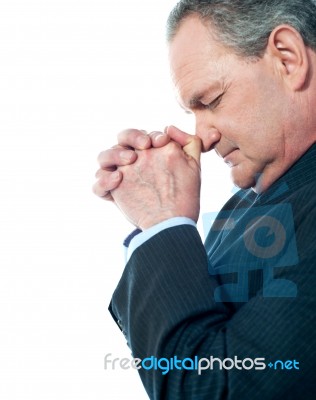 Matured male praying Stock Photo