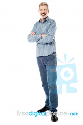 Matured Man Posing With Folded Hands Stock Photo