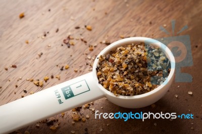 Measuring Spoon On Wooden Background Stock Photo