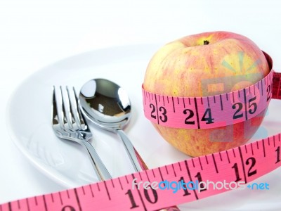 Measuring Tape Around Apple Stock Photo