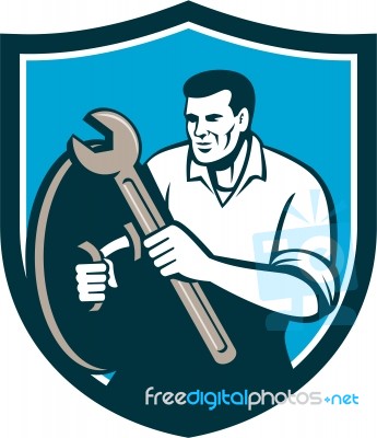 Mechanic Brandishing Spanner Wrench Shield Retro Stock Image