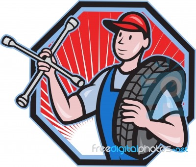 Mechanic With Tire Socket Wrench And Tire Stock Image