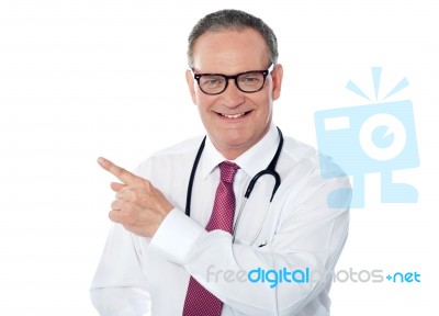 Medical Professional Pointing Back Stock Photo
