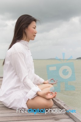 Meditation By Young Women Stock Photo