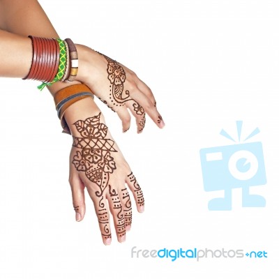 Mehendi Or Henna Tatoo On The Female Hands In Bracelets Isolated… Stock Photo