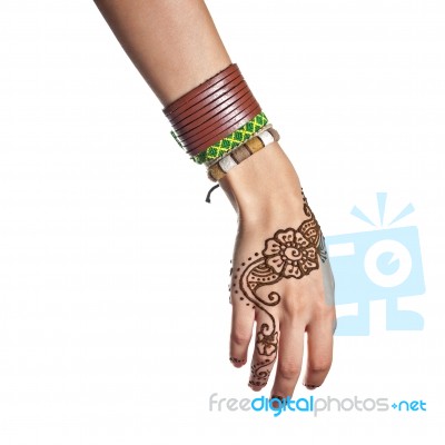 Mehendi Or Henna Tatoo On The Female Hands In Bracelets Isolated… Stock Photo