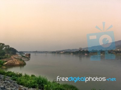 Mekong River And Bridge Crossing To Laos On Evening Stock Photo