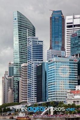 Merlion Fountain And Skyscrapers In Singapore Stock Photo