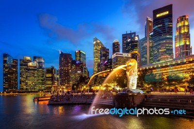 Merlion Statue And Cityscape In Singapore Stock Photo