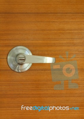 Metallic Silver Knob On Wooden Door Stock Photo