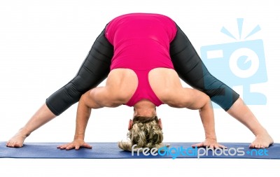 Middle Age Woman Doing Yoga Exercises Stock Photo