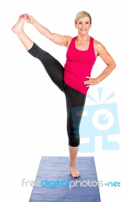 Middle Age Woman Doing Yoga Exercises Stock Photo