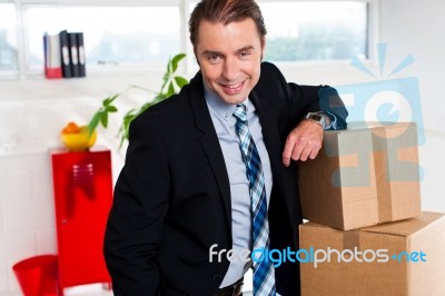 Middle Aged Businessman At His Relocated Office Stock Photo