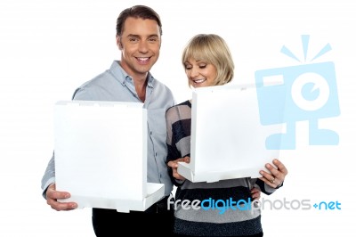 Middle Aged Couple Holding White Pizza Boxes Stock Photo