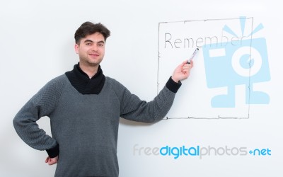 Teacher Pointing On Whiteboard Stock Photo