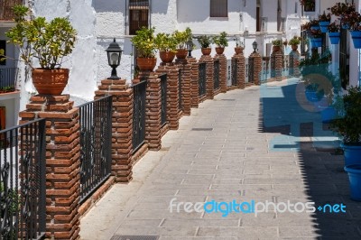 Mijas, Andalucia/spain - July 3 : View Of Brick Piers And Blue F… Stock Photo