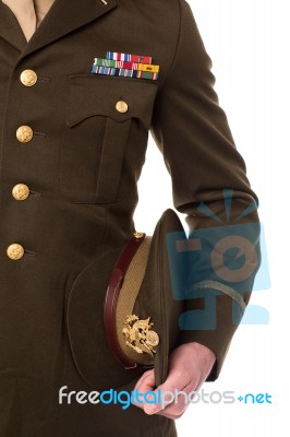 Military Personnel Holding His Precious Cap Stock Photo