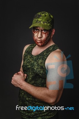 Military Style Camouflage On The Soldier's Face Stock Photo